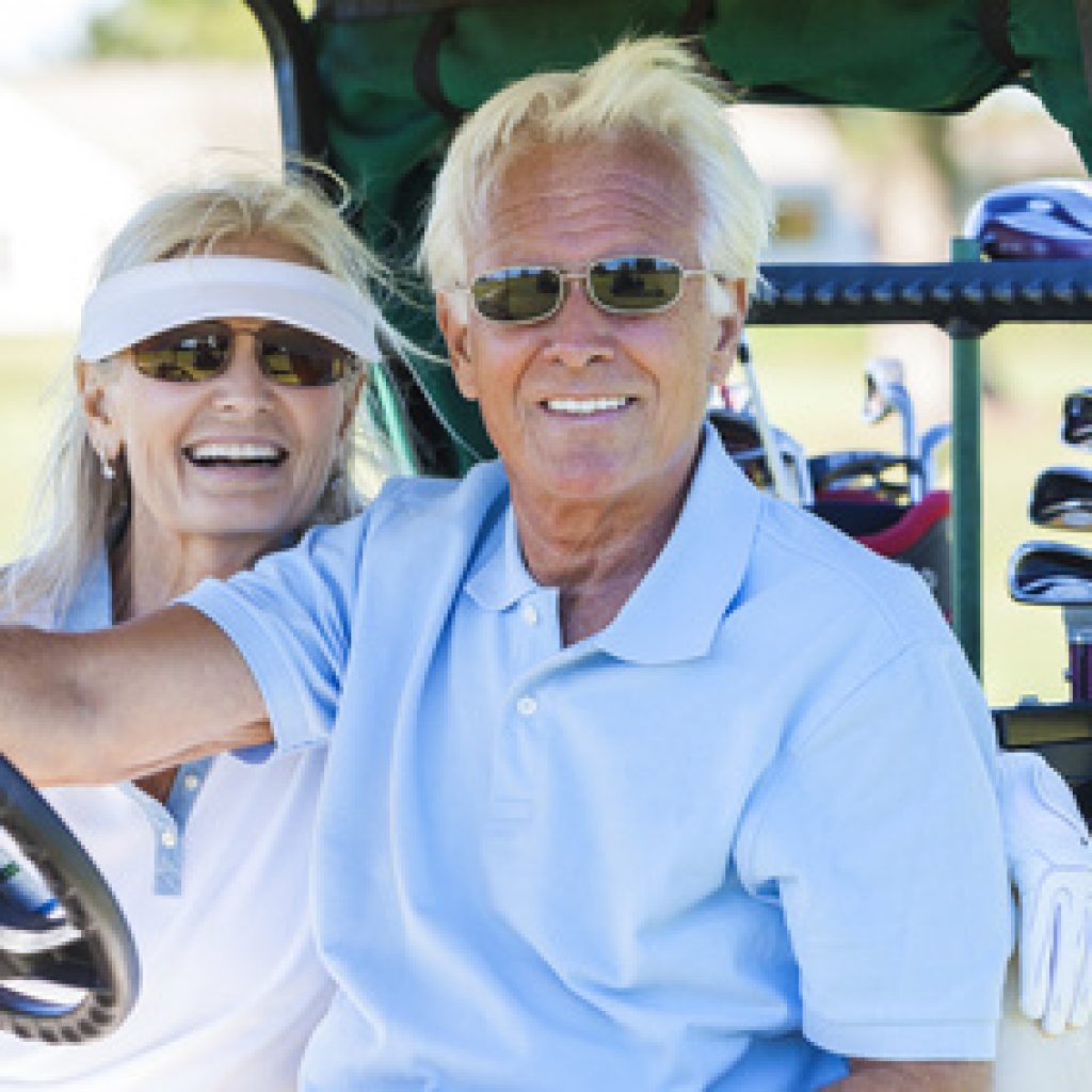 Senior-Couple-Playing-Golf-Driving-Cart-Buggy